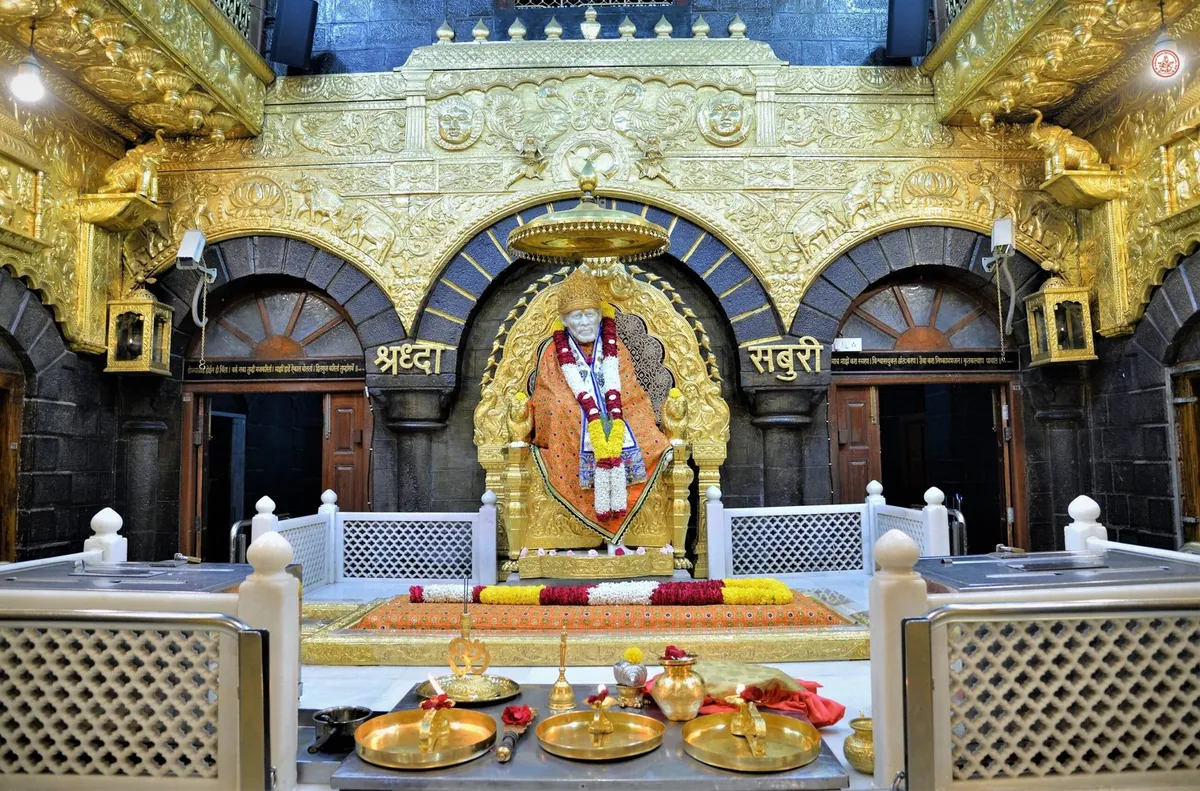 Sai Baba seated in the shrine at Shirdi